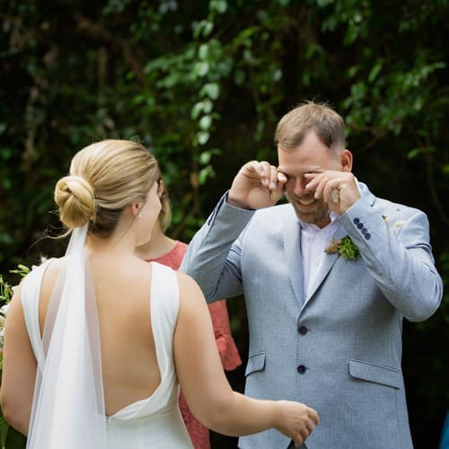 groom cries as his wife walks toward him at Midginbil Eco Resort NSW wedding