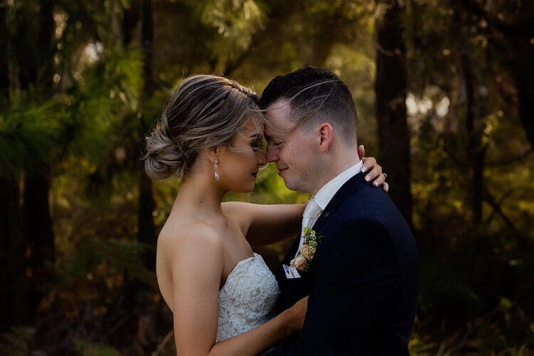 Couple embracing outdoor wedding photo