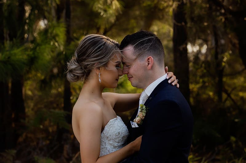 Couple embracing outdoor wedding photo