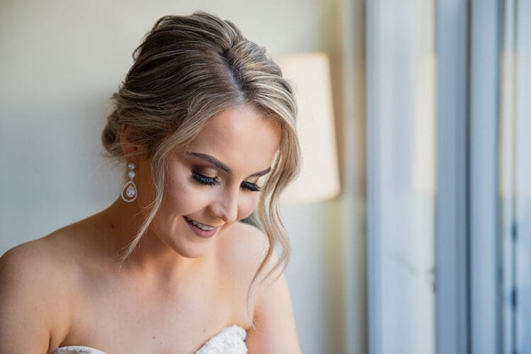 Bride smiling, elegant wedding makeup
