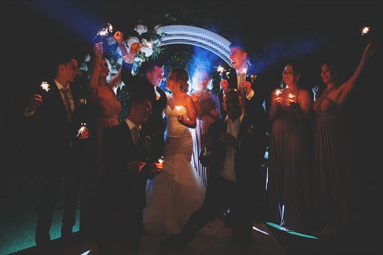 Sparkler photo with the bridal party at Osteria