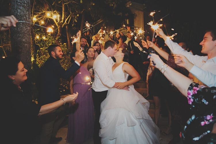 Wedding sparkler exit kiss on the stairs at Braeside Chapel