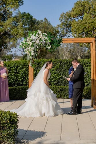  Laughing during a wedding ceremony conducted at Braeside Estate Gold Coast