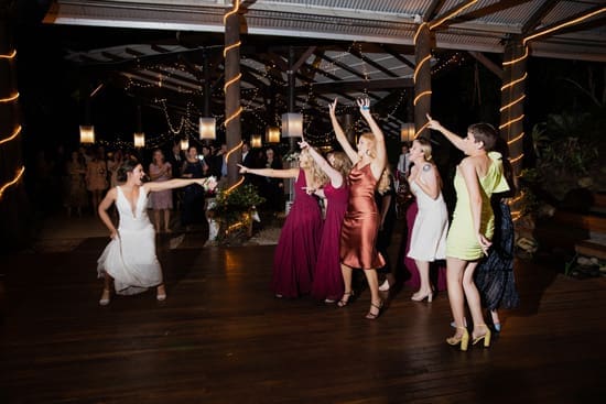 Bride throws the bouquet at wedding in Cedar Creek Lodges in Tamborine Mountain