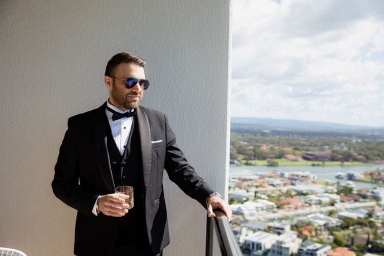 Groom having a drink before ceremony at JW Marriott Gold Coast wedding
