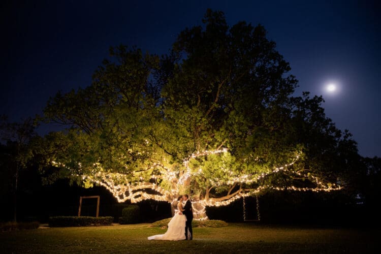 Night time wedding photo with moon taken at Braeside Estate by Follett Photography