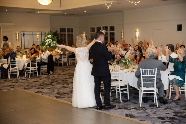Guests enjoying a joyful reception at Hillstone St Lucia, surrounded by elegant decor