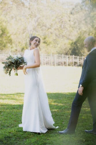 Nick checking out Trish's wedding dress moments after their first look.