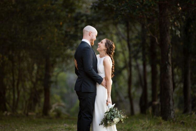 Bride laughing during sunset wedding portraits