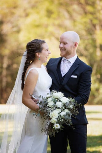 A couple just happy to be together while their are having their wedding photos taken