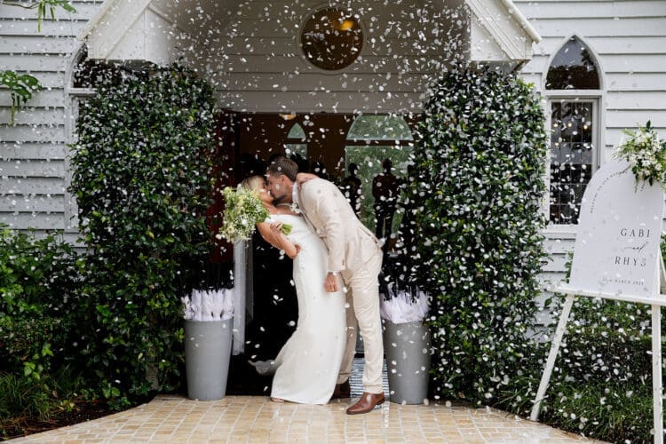 Confetti exit and dip kiss for bride and groom at Braeside Estate wedding