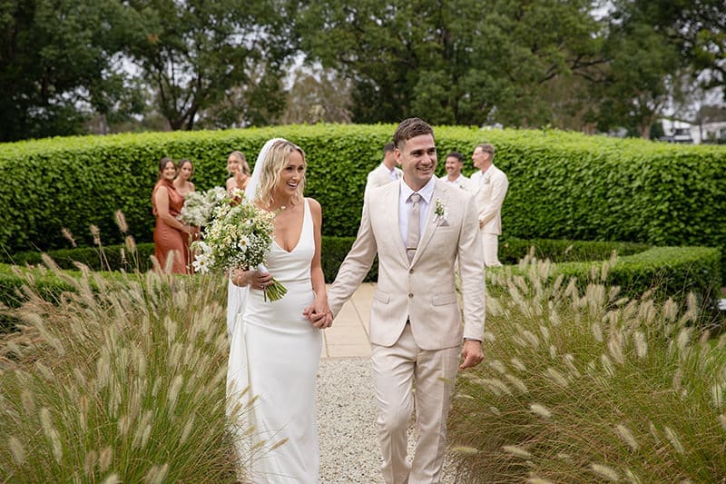 Bride and groom share a candid moment at Braeside Estate