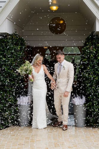Joyful confetti exit for the bride and groom at Braeside